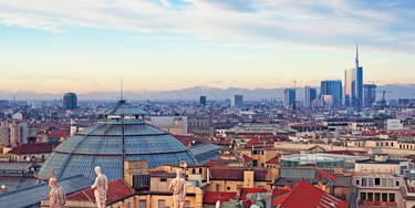 View of Milan from the rooftop of  “Duomo di Milano”. Statues of  Duomo of Milan, Galleria Vittorio Emanuele II and skycrapert of Porta Nouva also visible.